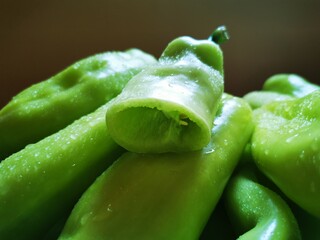 Drops of water on green organic pepper