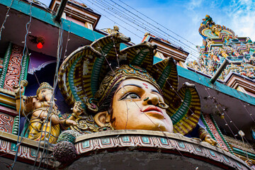 Closeup of the South Indian Hindu Goddess of Rain, Mariamman, Crowed with Five Cobras at the Sree Dandu Mariamman Temple in Bengaluru, India