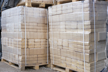 Sawdust briquettes are packed in polyethylene.