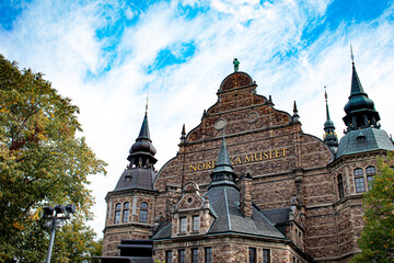 Looking up at the Curved Façade and Spires of the Nordic Museum (Nordiska Museet) in Stockholm, Sweden