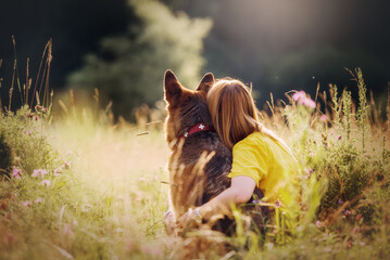 Portrait of german shepherd dog and a girl