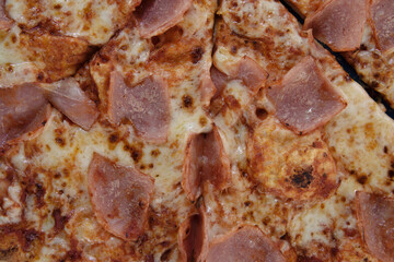 texture detail of pizza with ham
