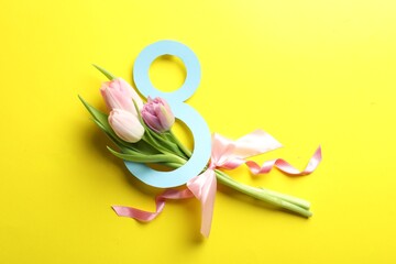 8 March card design with tulips on yellow background, flat lay. International Women's Day
