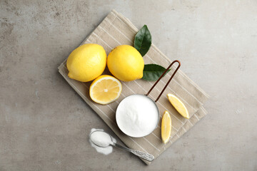 Baking soda and cut lemons on light table, flat lay