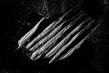 Cocaine line isolated on black background 