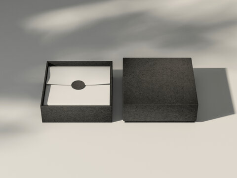 Two Square Black Boxes Mockup with white wrapping paper on white table, 3d rendering