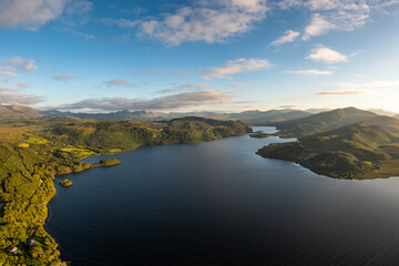 view of Lough Caragh lake in the Glencar Valley of Kerry County in warm eveing light