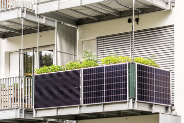 Solar panels on Balcony of  Apartment Building. Modern Balcony Apartment Solar power panel. - obrazy, fototapety, plakaty