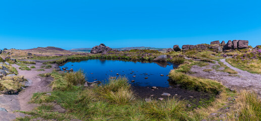 A view across Doxey Pool on the summit of the Roaches escarpment, Staffordshire, UK in summertime