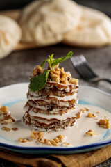 asian aubergine served in dish isolated on wooden table side view