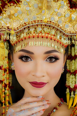 Portrait of beautiful Bride in bright traditional costume