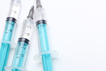 Medical syringe on a white background. A syringe for injection. The concept of health and beauty