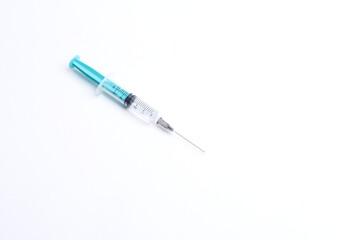 Fototapeta premium Medical syringe on a white background. A syringe for injection. The concept of health and beauty