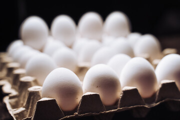 Organic raw group of eggs. Stack of eggs packed in cardboard container.