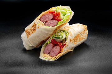 Shawarma with grilled sausage, vegetables and tomato sauce. Sausage in pita.