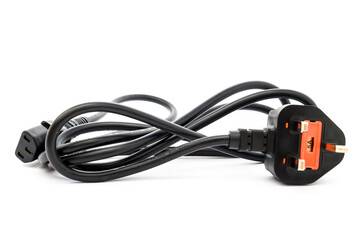 computer power cord with G-type plug with internal fuse close-up on white background