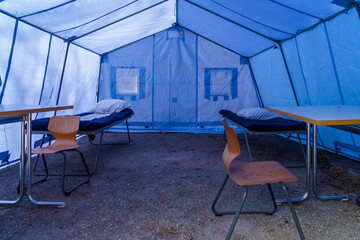 View inside the medical tent of a field hospital for emergencies. Background with selective focus...