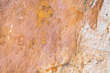 Background texture of sandstone stone surface, rough chopped orange stone for background