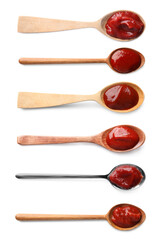 Set with tasty ketchup in spoons on white background, top view