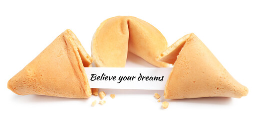 Tasty fortune cookies with prediction Believe your dreams on white background