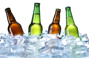 Bottles of beer on ice cubes against white background