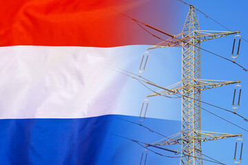 Netherlands flag on electric pole background. Power shortage and increased energy consumption in...