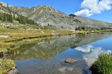 Fototapeta na wymiar Reflection on a mountain lake