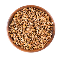 Utsho suneli seeds in wooden bowl, isolated on white background. Trigonella caerulea or blue fenugreek. Top view.