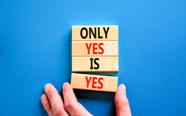 Only yes is yes symbol. Concept words Only yes is yes on wooden blocks on a beautiful blue table blue background. Businessman hand. Business, psychological only yes is yes concept.