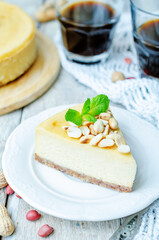 Peanut cheesecake in a plate on a wood background