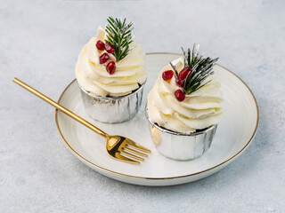 Christmas cupcakes and decor on light  table