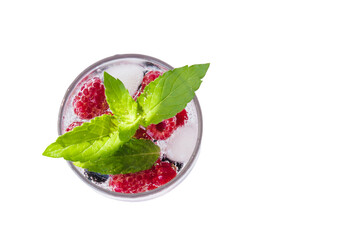 Carbonated drinks with fresh berries, mint and ice. Fresh cold sparkling bubble water with mint,...