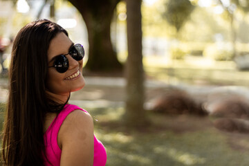 Smiling young girl posing in a park