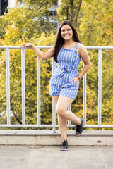 Smiling young girl posing in a park