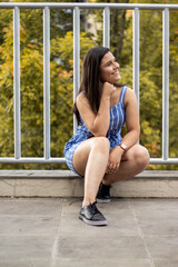 Smiling young girl posing in a park