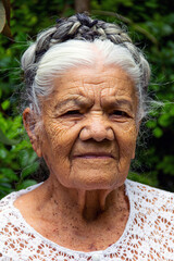 mexican grandmother looking at the camera