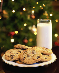 Close-up of a glass of milk and a plate of cookies