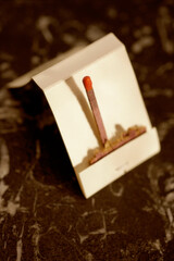 Close-up of a matchstick in a matchbox