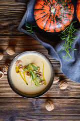 Creamy pumpkin and walnut soup in a bowl