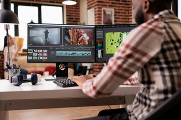 Content creator editing video montage on film production software, working on movie footage to...