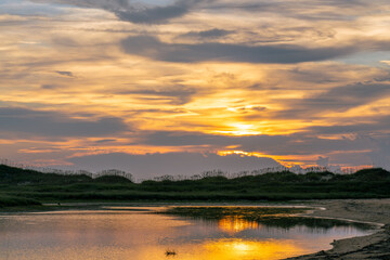 Sunrise Reflecting off Tidal Marsh on Hatteras Island in the Outer Banks Near Cape Point