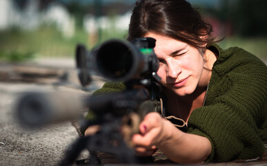 female sniper with a sniper rifle
