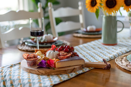 Fall charcuterie board on a dining table