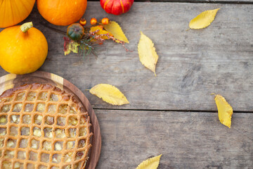 Thanksgiving background. Thanksgiving pumpkins on wooden background. Pumpkin pie. Banner. copy space