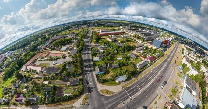 circular rotation with twisting of the landscape of the city from the height of the flight into a tiny planet and transformation into a blue sphere