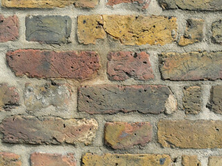 Old Brick wall weathered and damaged