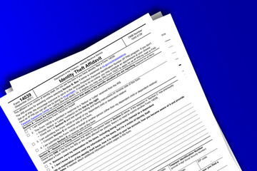 Form 14039 documentation published IRS USA 44205. American tax document on colored