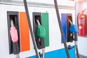 Colorful Petrol pump filling nozzles isolated on white background , Gas station in a service in...