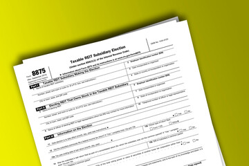 Form 8875 documentation published IRS USA 41952. American tax document on colored