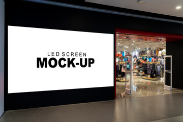Mockup vertical LED Screen at front of shop in shopping mall - 529070175
